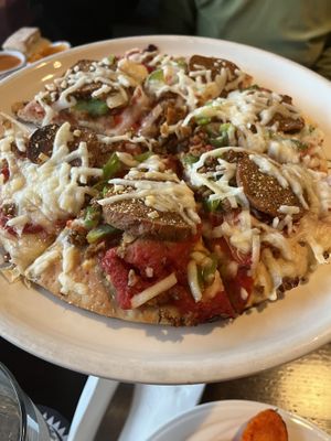 Vegan cheese pizza with seitan pepperoni and vegan sausage   at Lennie's in Bloomington