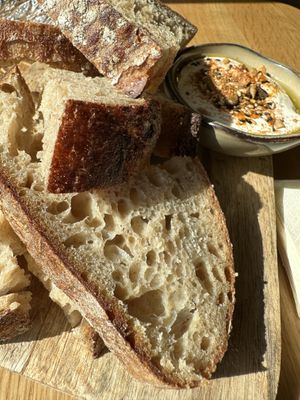 Zuurdesembrood van Meneer Leffers met citroen-knoflooklabneh en dukkah    at Flow Yoga & Food in Delft