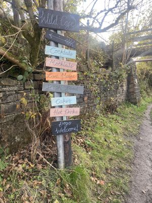 Signpost from the canal by Sparth reservoir  at Wild Cafe in Marsden