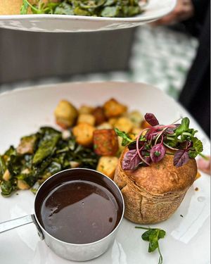 LENTIL & SPINACH STEAMED PUDDING vegan suet pastry with lentils, kidney beans and wild mushrooms, served with chunky chips, green beans and red wine gravy

 at Albert's Worsley in Swinton
