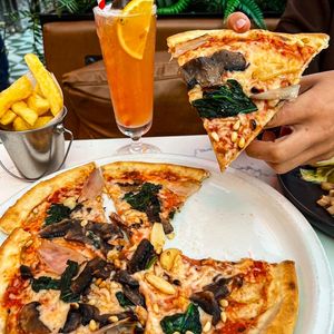 WILD MUSHROOM, ROASTED SHALLOT & WHITE TRUFFLE PIZZA with wilted spinach, toasted pine nuts and vegan cheese (Available on the Vegan menu and the £14.95 Vegan set menu)

 at Albert's Worsley in Swinton