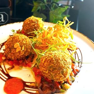 BASIL ARANCINI with a san marzano sauce, straw fries and an olive and sun-blushed tomato salsa (Available on the Vegan menu and the £14.95 Vegan set menu)

 at Albert's Worsley in Swinton