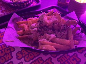 Garlic parm loaded fries with parsley   at The Saucy Cow in Dublin