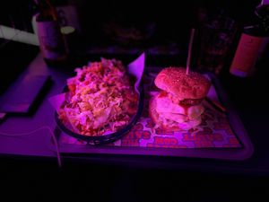 Cheeseburger loaded waffle fries, with gherkins , burger sauce, lettuce and crumbled burger. The buckfast burger ( buckfast bbq sauce) onion rings , smashed beef , cheese. 😋😋 at The Saucy Cow in Dublin