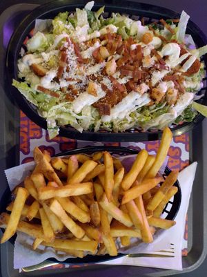 Chicken caesar salad and fries at The Saucy Cow in Dublin