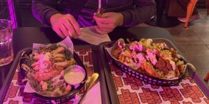 Caesar salad and waffle fries with mushroom “chicken"  at The Saucy Cow in Dublin