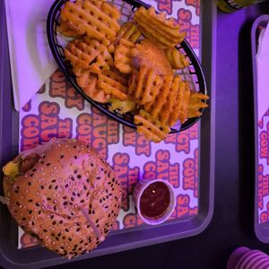 Space cowboy burger with a side of waffle fries and bbq sauce at The Saucy Cow in Dublin