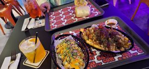 Spicy tofu, festive loads fries and the burnt peach martini at The Saucy Cow in Dublin