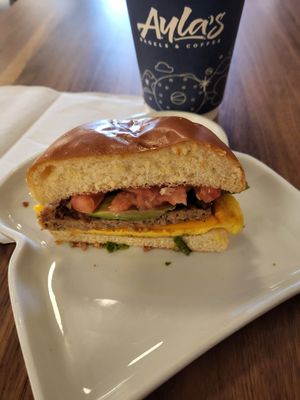 Vegan trifecta with avocado and tomato on vegan brioche bun. at Ayla's Bagel & Coffee in Woodbury