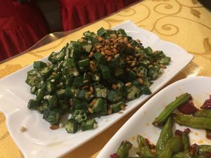 A HUGE plate of fabulous okra and pine nuts.  at Beijing Zheng Long Zhai in Beijing