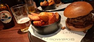 Burger with side of potato wedges at Lebowskis in Glasgow