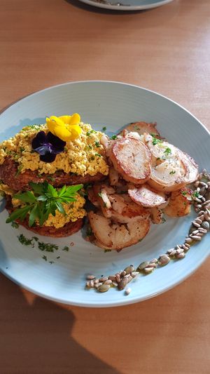 Scrambled tofu on sourdough with crispy potatoes added on the side at Wild Pear Kitchen in New Plymouth