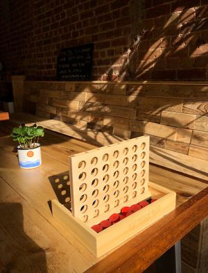 Coffee and a game of 4 in a row?… ok then! at Rising Tide in Brighton