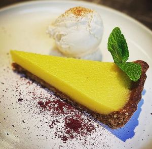 Lemon tart at VIBE Plant Based Cafe & Restaurant in Douglas