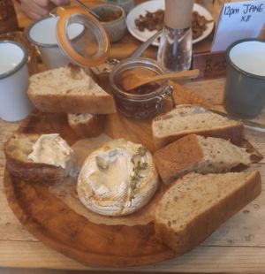 Baked 'camembert' with noa's bloomer and sweet onion pickle at VIBE Plant Based Cafe & Restaurant in Douglas