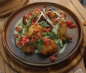 Smashed roasties with basil cream & salsa at VIBE Plant Based Cafe & Restaurant in Douglas