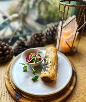 Butterbean, paprika and walnut no sausage roll with homemade beetroot & rhubarb ketchup   at VIBE Plant Based Cafe & Restaurant in Douglas