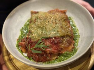 Beetroot & green lentil lasagne with watercress béchamel and pine nut pesto   at VIBE Plant Based Cafe & Restaurant in Douglas