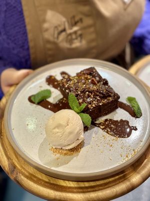 Chocolate and sweet potato fudge brownie with orange z’atar & pecans   at VIBE Plant Based Cafe & Restaurant in Douglas
