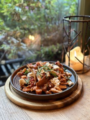 Greek loaded sweet potato wedges with crumbled tofu feta and jackfruit Kokkinisto   at VIBE Plant Based Cafe & Restaurant in Douglas
