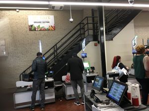 Go up these stairs (near the cash registers) for the health food items at Fairway - Upper West Side in New York City