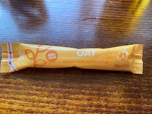 Oat milk sachet for the tea at The Greyhound in Bromley