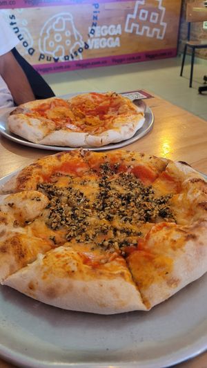pizza with homemade vegan cheese and pesto at Vegga in Bogota