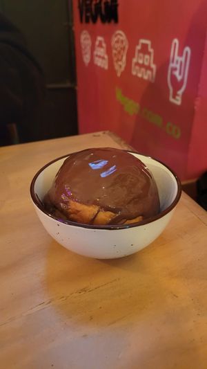 fresh donut with warm chocolate at Vegga in Bogota