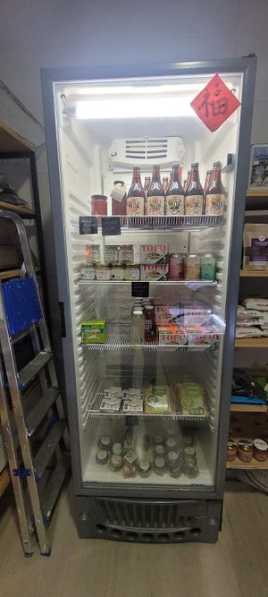 Refrigerator with juice, beer, cheese, kombucha at Mundo Vegano in Colonia Del Sacramento