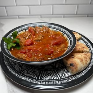 Vegan Shakshouka with vegan sausage and potatoes  at Java Dive Organic Cafe - Mediterranean Restaurant in Bee Cave