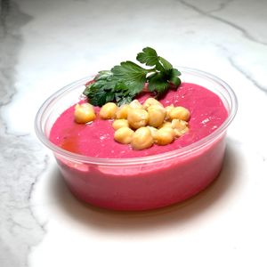 Weekly vegan hummus, in picture beet hummus  at Java Dive Organic Cafe - Mediterranean Restaurant in Bee Cave