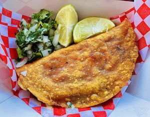 Quesabirria: Crunchy taco, filled with mozzarella and veg birria.  at Viva Vegan in Colton