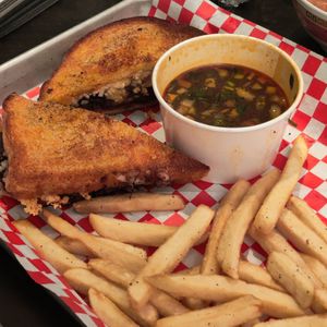 Birria Melt - sourdough w/Follow your heart mozz + birria+ fries + consome at Viva Vegan in Colton