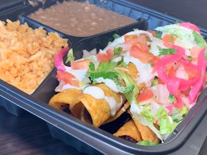 Vegan Shredded "Beef" Taquitos: Corn Tortillas, Jackfruit, Lettuce, Vegan Cotija Cheeze & Crema, Pico de Gallo, Avocado Sauce, Rice, Beans. at Viva Vegan in Colton