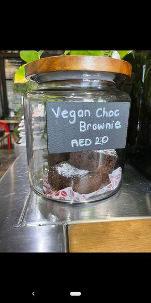 Vegan brownie near cashier at RAW Coffee Company in Dubai