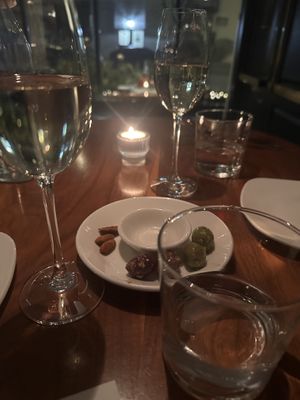Marinated olives and spiced almonds with complementary Prosecco.  #Veganuary at Alma in Minneapolis