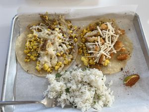 Had cilantro rice, vegan sausage egg and cheese, and vegan “mommie dearest”. This was so delicious with spicy ketchup!  at Basalt in Grand Rapids