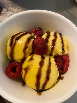 Mango sorbet with raspberries and a pomegranate balsamic reduction drizzle at Idlewild Spirits Brewpub and Restaurant in Winter Park