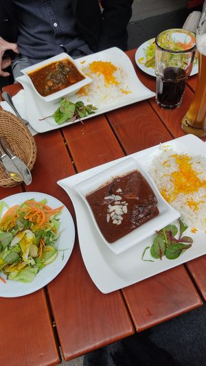 Pomegranate (front) and Spinach-Plum (back) dish with side salads at Shayan in Berlin