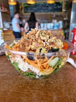 Spinach, couscous, lentils, mango dressing, cucumber, tomatoes, black olives, topped with mixed nuts and crispy onions 😋 at The Bowl Haus in Lanzarote