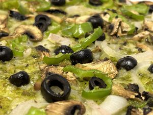 The Foresta - Pesto sauce, vegan mozzarella, mushrooms, black olives, green pepper and Figueres onion.  at Sabriona Pizzeria in Girona