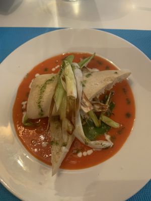 Starter of Charred leak with a red pepper sauce and ciabatta   at Patio@49 in Mallorca