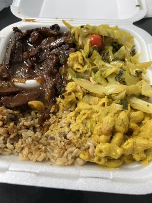 peppered stek , kale and spinach, brown rice and peas with gravy and mac n cheeze  at Di-Vine Plant Based Cuisine in Forest Park