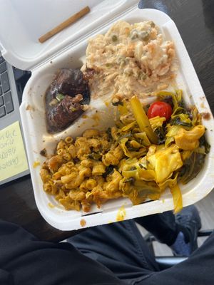 Sorry, couldn’t wait to dig in. Jerk chicken, potato salad, cabbage and Mac and cheese.  at Di-Vine Plant Based Cuisine in Forest Park
