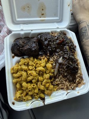 Jerk chicken with rice and peas, and Mac and cheese !   at Di-Vine Plant Based Cuisine in Forest Park