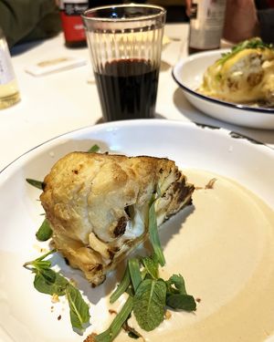 Grilled cauliflower with tahini  sauce, lemon zest, tarragon and mint at Hummus Kimchi in Yerevan