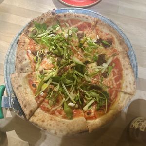Vegan lamb pizzaa  at Stockport Produce Hall in Manchester