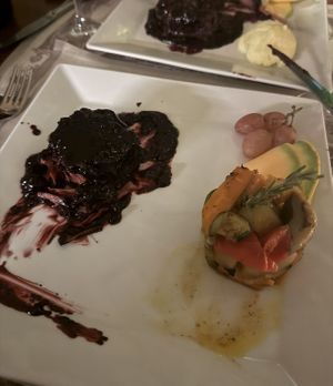 my vegan blueberry steak versus the real across the table   at Acqua al 2 in Florence