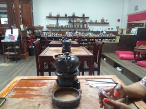 Interior: Yes, you can enjoy your tea on the pillows with your shoes off. Or, in chairs at higher tables. at Ching Ching Cha in Washington