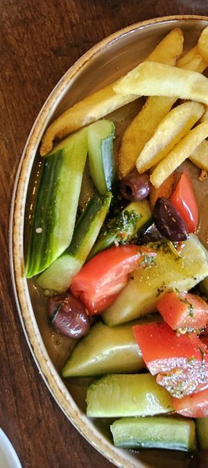 salad and fries at Happy Bar & Grill in Plovdiv
